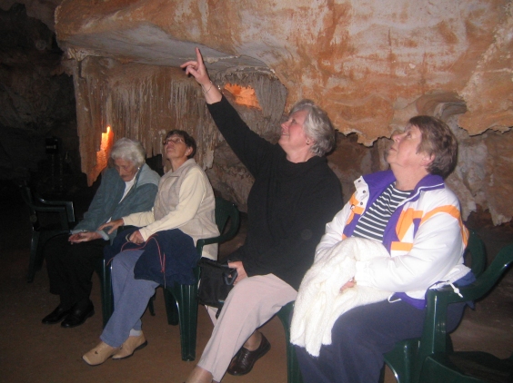 Visitors relaxed on seats in the cave